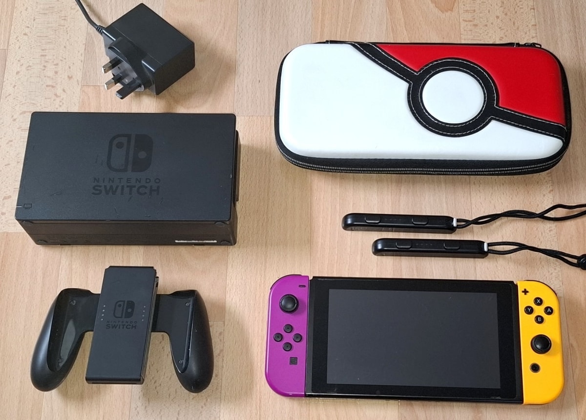 Nintendo Switch Console w/ Purple + Orange Joy-Con Controllers + Case + 128 GB