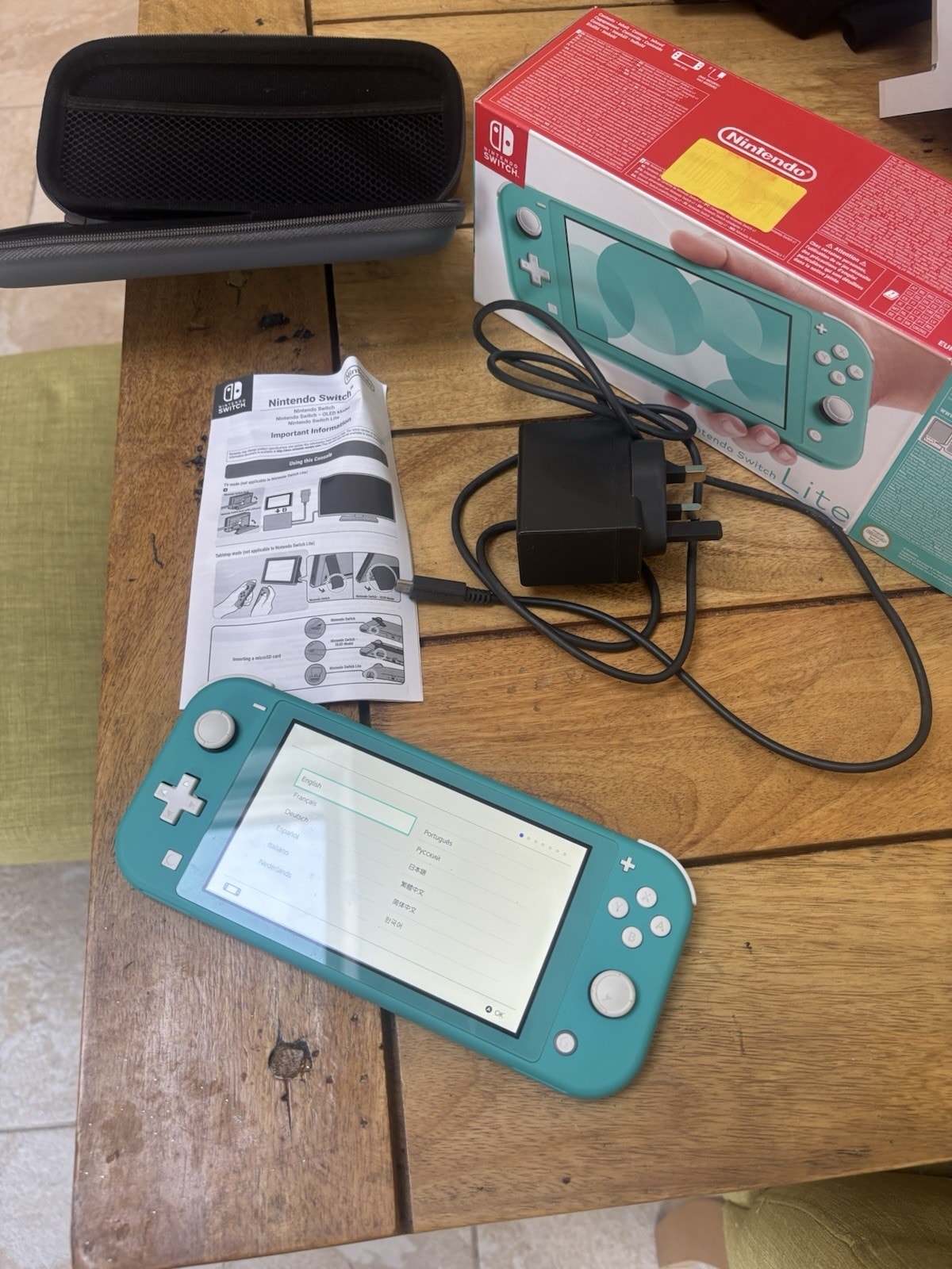 Nintendo Switch Lite Turquoise With Charger And Case