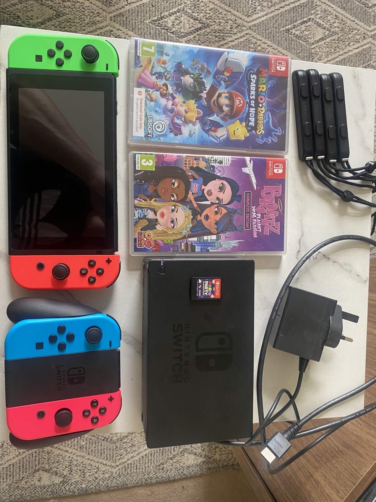Nintendo Switch + Charger, 4 Controllers, Docking Station and 3 Games + Joy-Con