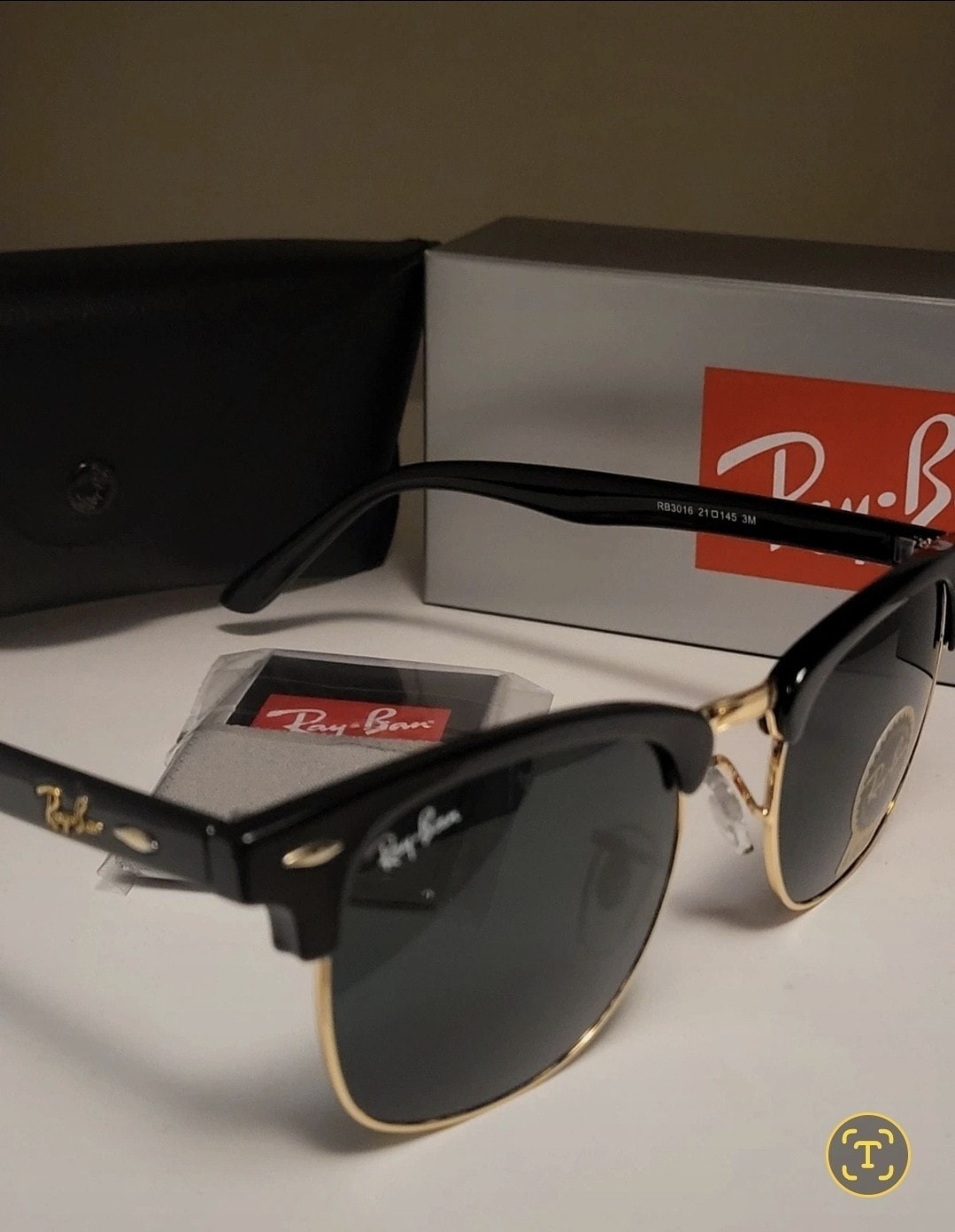 Ray-Ban Sunglasses.