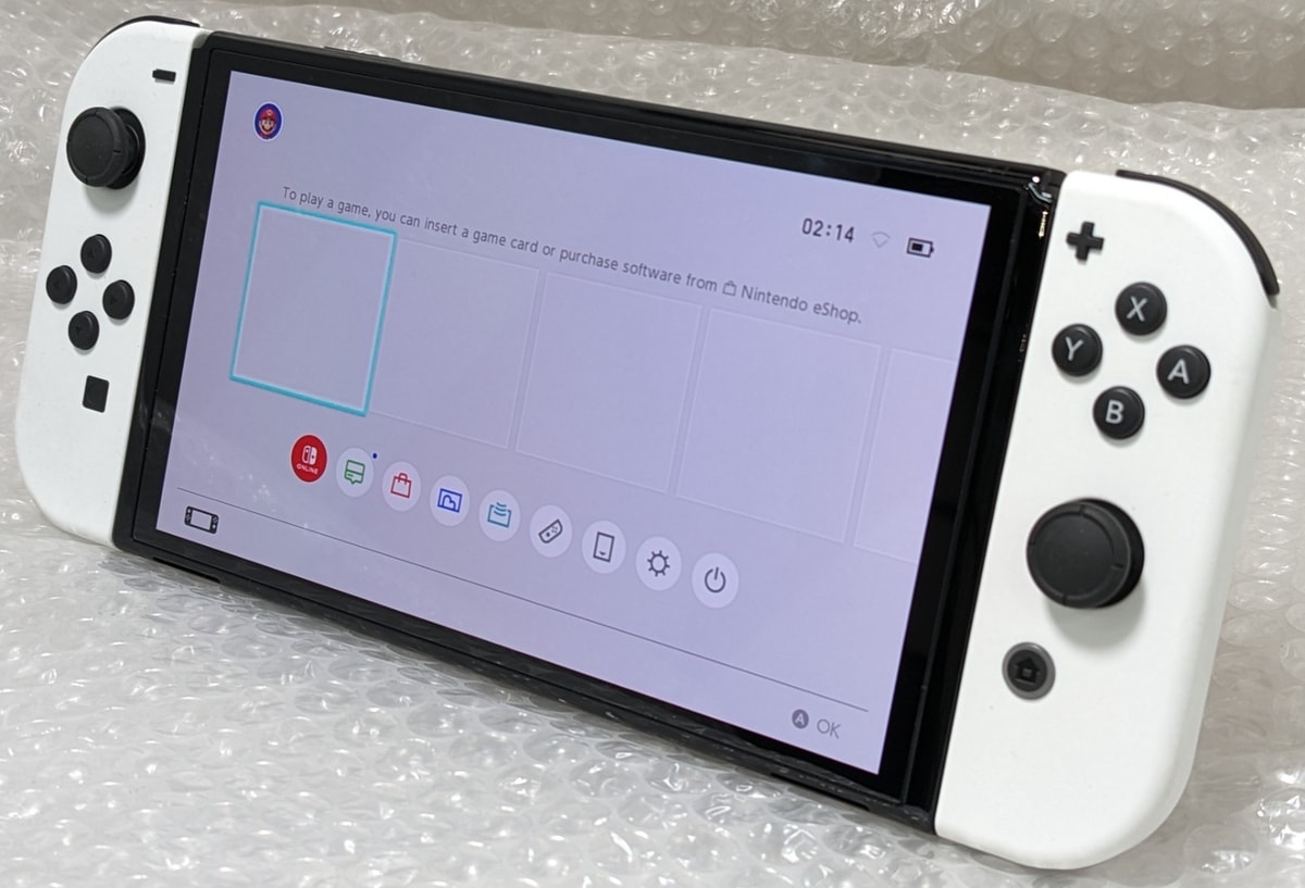 Nintendo Switch (OLED Model) 64GB Handheld Video Games Console w/ White Joycons