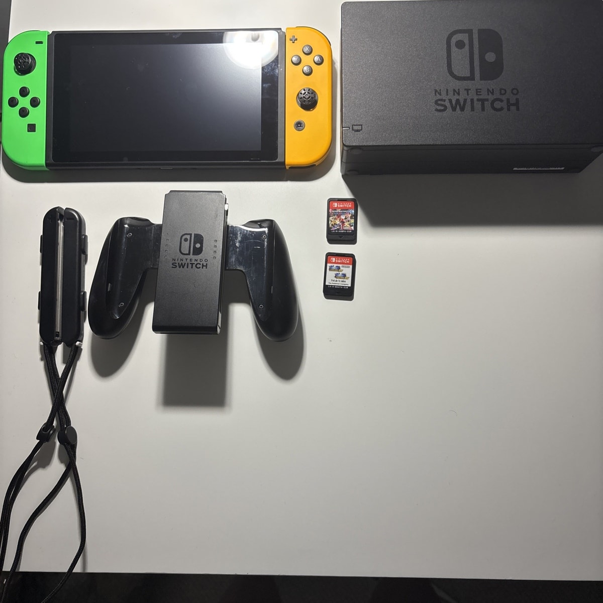 Nintendo Switch + 2 Free Games Cards (Mario Kart & Pokémon DX)
